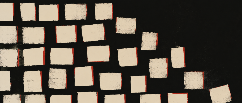 An abstract arrangement of blank bone-coloured cards with red edges